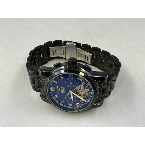 95 - A Gents Kinyued Mechanical Calendar Watch - Blue Skeleton Dial, Black Metal Case and Strap. Working