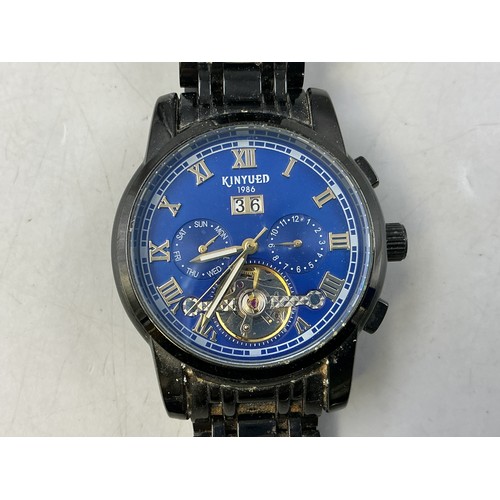 95 - A Gents Kinyued Mechanical Calendar Watch - Blue Skeleton Dial, Black Metal Case and Strap. Working