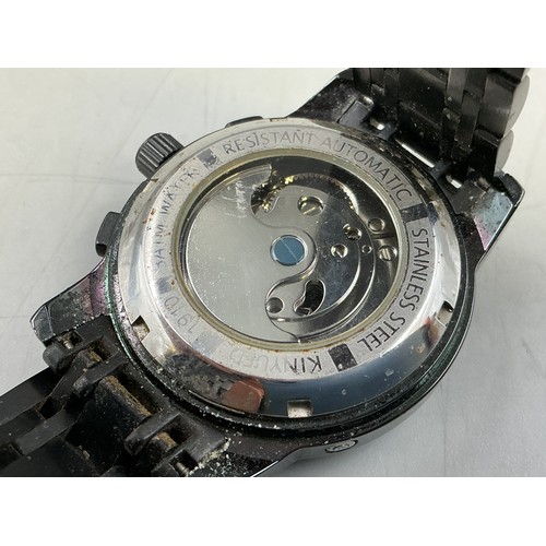 95 - A Gents Kinyued Mechanical Calendar Watch - Blue Skeleton Dial, Black Metal Case and Strap. Working