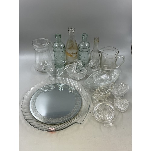 714 - Large Selection of Quality Glassware includes Mirrored Plate, Shell Serving Dish, Jugs, Wine Bottles... 