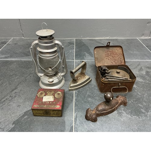 785 - A boxed Primus stove (untested) a storm lantern and a vintage oxo tin. a flat iron and a small door ... 