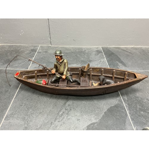 Large Vintage Resin Fisherman in a Longboat Ornament complete with Dog, Fish and others 73cm long a/f