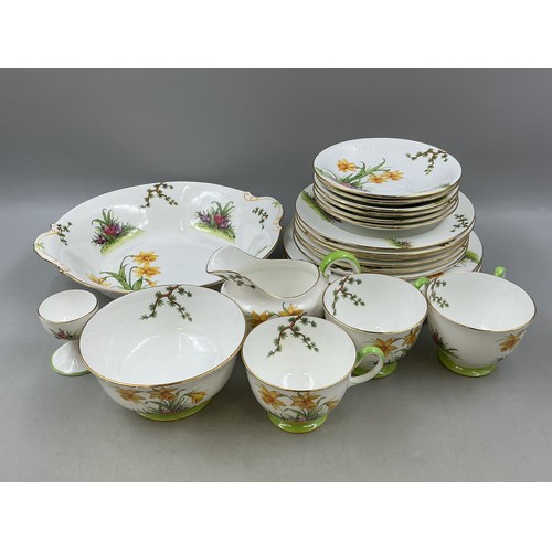 Twenty three Pieces of Aynsley Fine Bones China Decorated with in a Floral Design with Yellow Daffodils and Crocuses