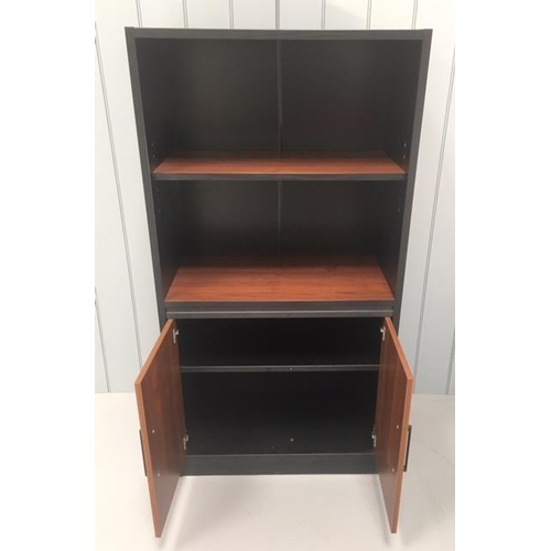 21 - An MDF modern office cupboard, consisting of a single shelf above a two-door cupboard. Black and wal... 