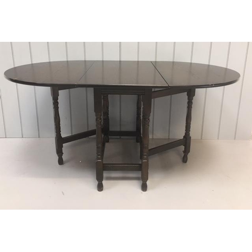 187 - A vintage typical dark oak gateleg table.
Dimensions(cm) Closed H74 W89 D50. 
Open H74 W150 D89