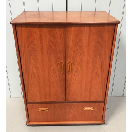 76 - A G-Plan Teak TV Cabinet. 2-door cupboard, over a single drawer. Drawer has dividers in place. Unit ... 