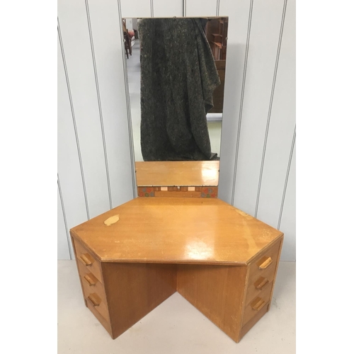 117 - An unusually shaped dressing table. 
A narrow tall mirror sits above 2 sets of 3 drawers. The drawer... 
