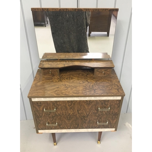 123 - A typical veneered retro dressing table. Large, full width mirror sits over 2 small drawers and in t... 