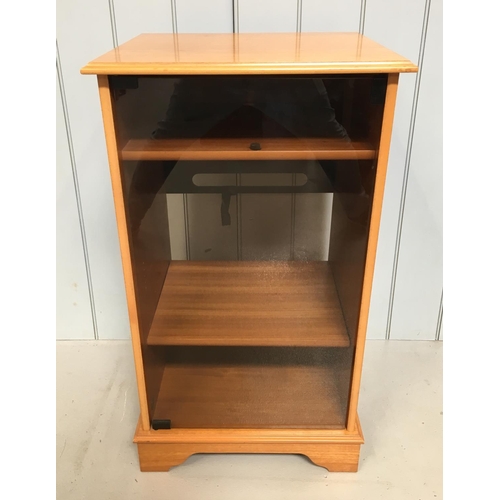 150 - A traditional mid-century teak Hi-Fi cabinet on castors.
Smoked glass door with a top shelf for a tu... 