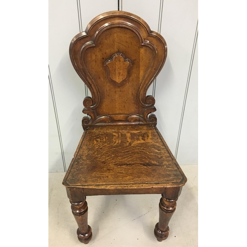 147 - A charming oak, carved Hall Chair.
Dimensions (cm) H82 W42 D39