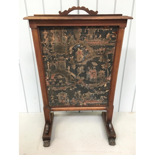 64 - A lovely oak fire screen, with oriental decoration and clawed feet. Screen can be height adjusted.
D... 
