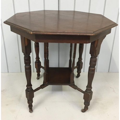 141 - An intricate octagonal occasional table.
Suspended internal shelf, on castors.
Dimensions(cm) H72 W7... 