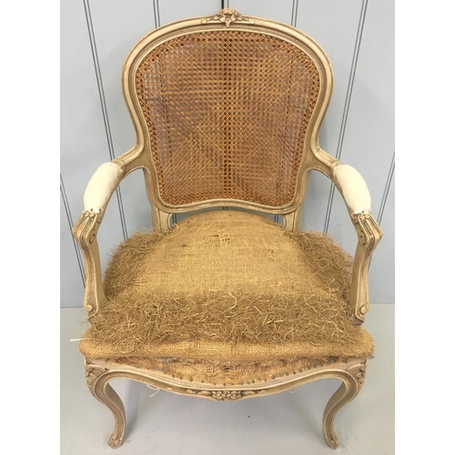 175 - A classic, uncovered Queen Anne style antique armchair. Cane backed, on cabriole legs.
Dimensions(cm... 