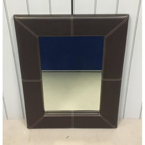 54 - A large, faux-leather padded frame mirror.
Dimensions(cm) H106 W81 D5