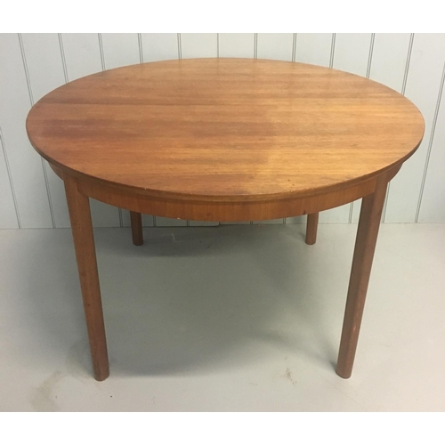 2 - A superbly designed Mcintosh teak, round dining table.
Centre leaf extension present. Table divides ... 