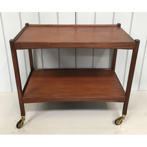 138 - A charming, mid-century tea trolley. 
Teak on brass castors.
Dimensions(cm) H66 W76 D45