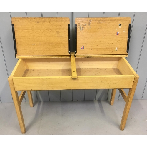 136 - A traditional, vintage children's double school desk.
Hinged desk lid, with storage beneath.
Dimensi... 