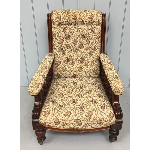 178 - A traditional lounge chair.
Wood framed, floral patterned fabric, on castors.
Dimensions(cm) H 93 W7... 