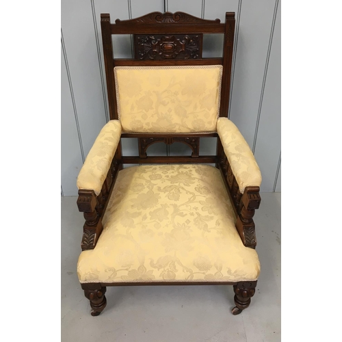 179 - A stunning grand armchair.
Carved frame, with cream fabric covering, set on brass castors.
Dimension... 