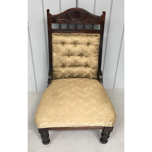 177 - A low armless lounge chair.
Gold fabric covered, with a carved frame.
Dimensions(cm) H93 W57 D60