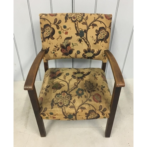 142 - A floral patterned, low armchair.
Dimensions(cm) H 69 W51 D45