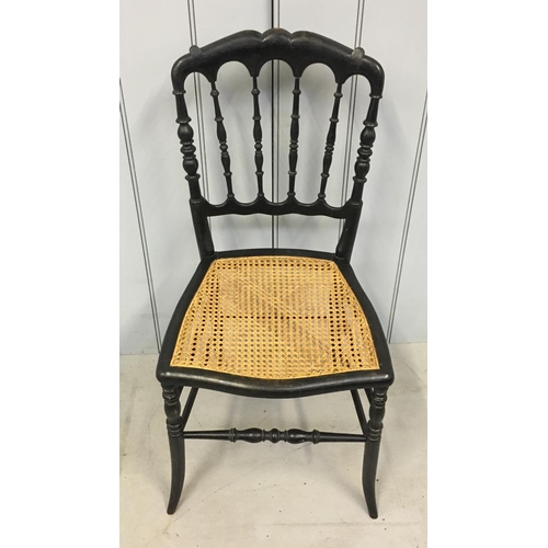 144 - A rattan hall chair, with an ebonized frame.
Dimensions(cm) H 87 W42 D37