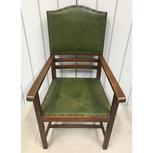 156 - A quality oak armchair. High-backed with green leather upholstery.
Dimensions(cm) H109 W59 D57