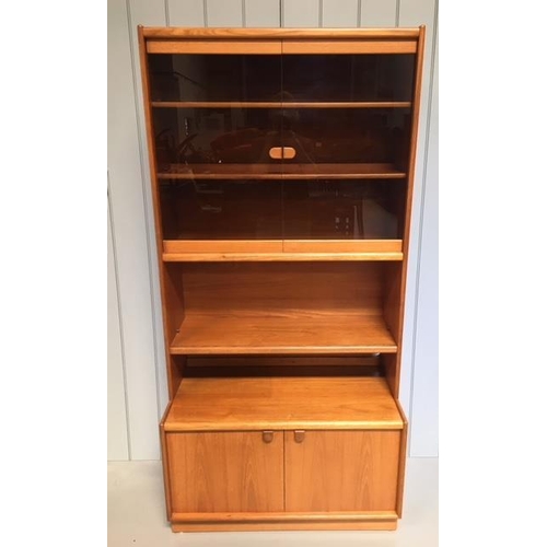 80 - A typical Remploy display cabinet. Glazed display area with 2 shelves, over a single teak shelf, ove... 