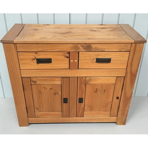 84 - A dark Pine narrow sideboard. 2 drawers above a single-shelf, 2-door cupboard.
Dimensions(cm) H84 W1... 