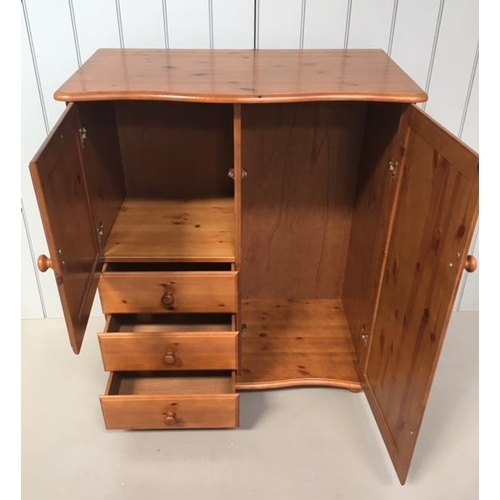 89 - A Duckers pine tallboy. Tall, single cupboard alongside a shorter cupboard, over 3 single drawers. T... 