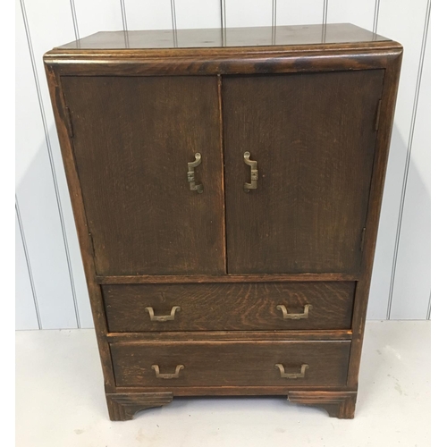 105 - A standard oak Tallboy. Single-shelved 2-door cupboard over 2 full width drawers.
Dimensions(cm) H 1... 