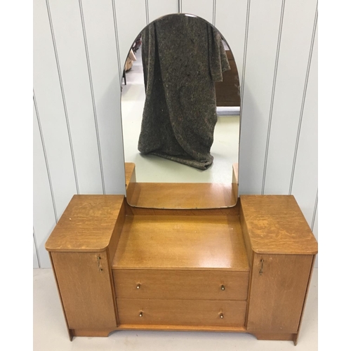 109 - A traditional single mirrored dressing table by Austinsuite. The large mirror sits over 2-drawers an... 