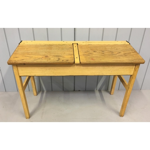 136 - A traditional, vintage children's double school desk.
Hinged desk lid, with storage beneath.
Dimensi... 