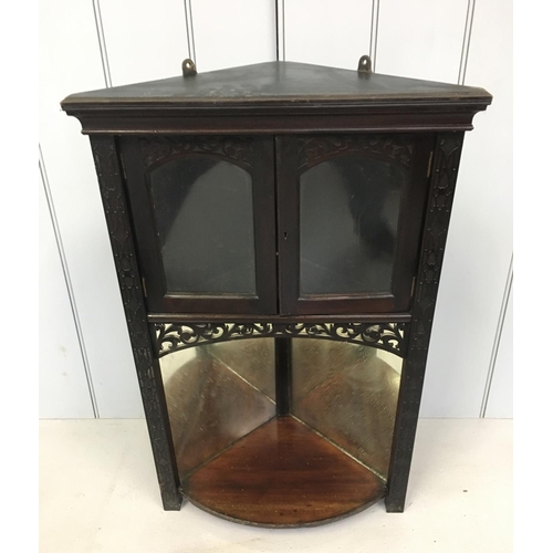 149 - A small, ebonized hanging corner cabinet.
Cupboard above mirror backed shelf.
Dimensions(cm) H77 W51... 