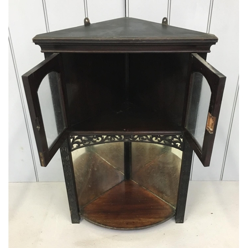 149 - A small, ebonized hanging corner cabinet.
Cupboard above mirror backed shelf.
Dimensions(cm) H77 W51... 