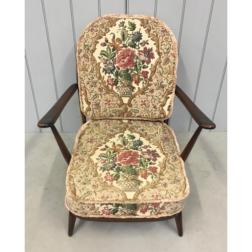 161 - A carved back easy chair in the style of Ercol.
Dimensions(cm) H85 W72 D75