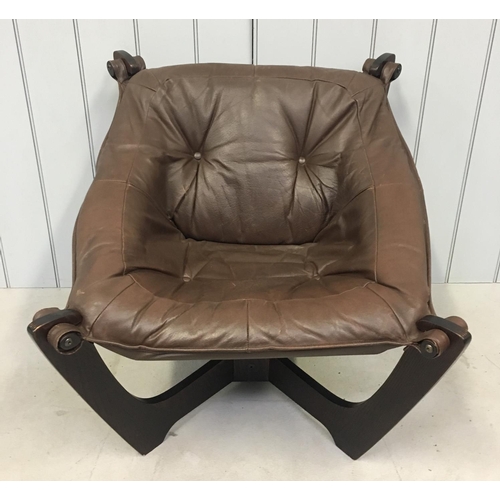 164 - A stunning retro leather lounge chair.
Brown leather supported by Astro-style legs.
Dimensions(cm) H... 