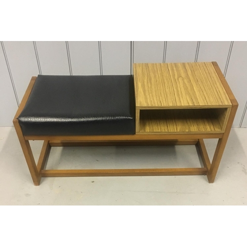 201 - A retro veneered, telephone table with black vinyl seat.
Dimensions(cm) H43 W83 D35