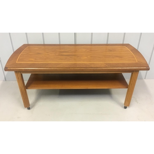 202 - A single shelved teak coffee table, on castors.
Dimensions(cm) H43 W104 D45