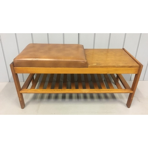 203 - A classic retro teak telephone table.
Brown vinyl seat.
Dimensions(cm) H41 W94 D40