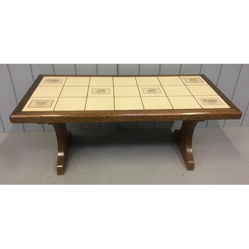 204 - An unusual vintage tiled coffee table, from the 1980's.
The coffee table can be raised by 13cm to a ... 