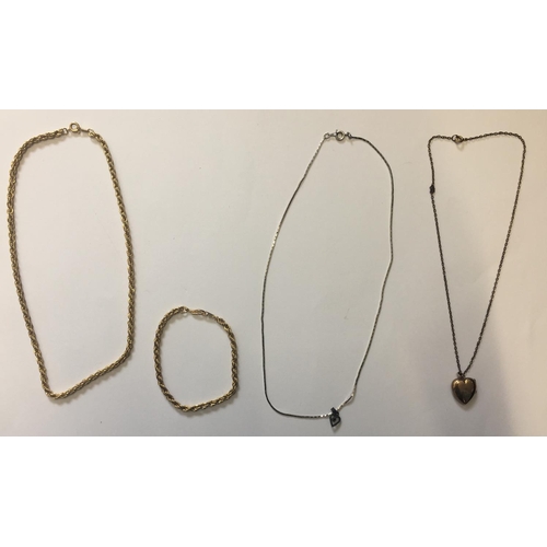 326 - A mixed lot of 4 pieces of costume jewellery.
A yellow metal chain and matching bracelet, a yellow m... 