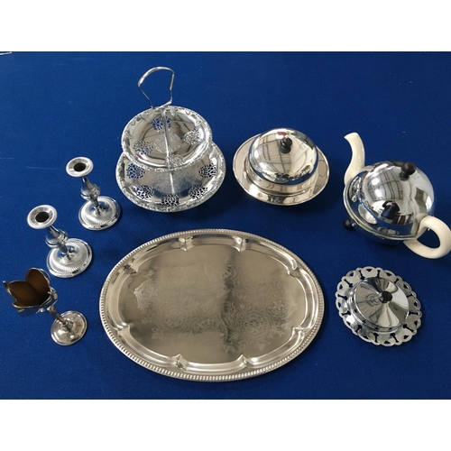 374 - A mixed lot of 8 items of metal tableware. To include a cake stand, pair of candlesticks, vase, tray... 