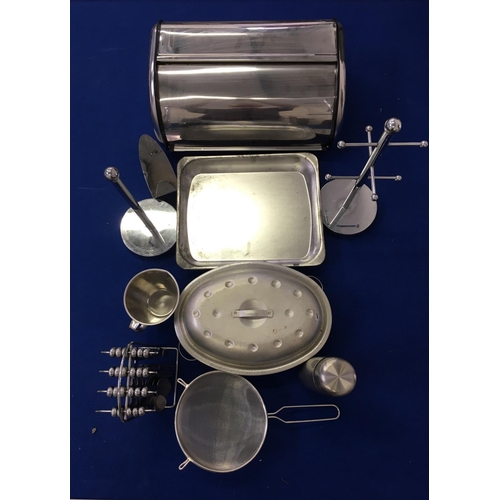 412 - A mixed lot of kitchenware. includes scales, trays, tupperware and a large amount of cutlery etc.