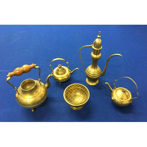 414 - A mixed lot of decorative brassware. includes teapots, kettle etc.