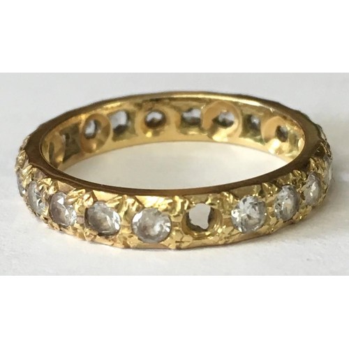 337 - An 18ct Gold ring with jewelled surround.
Size N.