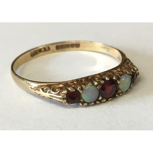 345 - A pretty 9ct Gold Opal & Garnet ring by Charles Lyster & Co. Dates from c.1900.
Size R.