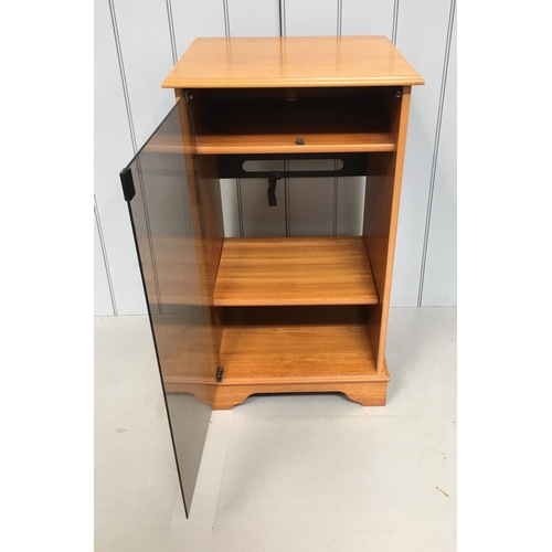 150 - A traditional mid-century teak Hi-Fi cabinet on castors.
Smoked glass door with a top shelf for a tu... 