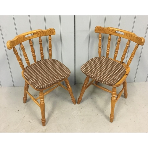 169 - A modern pair of pine, spindle-backed, kitchen chairs.
Dimensions(cm) H79 W50 D40