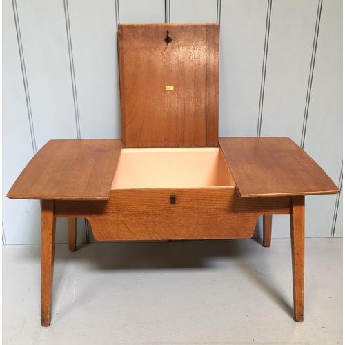 190 - An Eglin sewing table, with hinged centre storage area.
Could be used as a coffee table.
Dimensions(... 